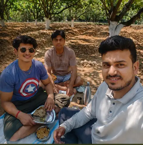 The DK Nature Farms family taking a meal together in the orchard